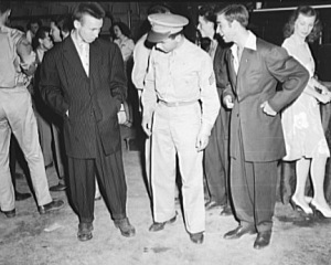 Zootsuits became an integral part of Mexican American culture and other Americans began connecting these suits to the violence of gangs. http://en.wikipedia.org/wiki/Zoot_suit